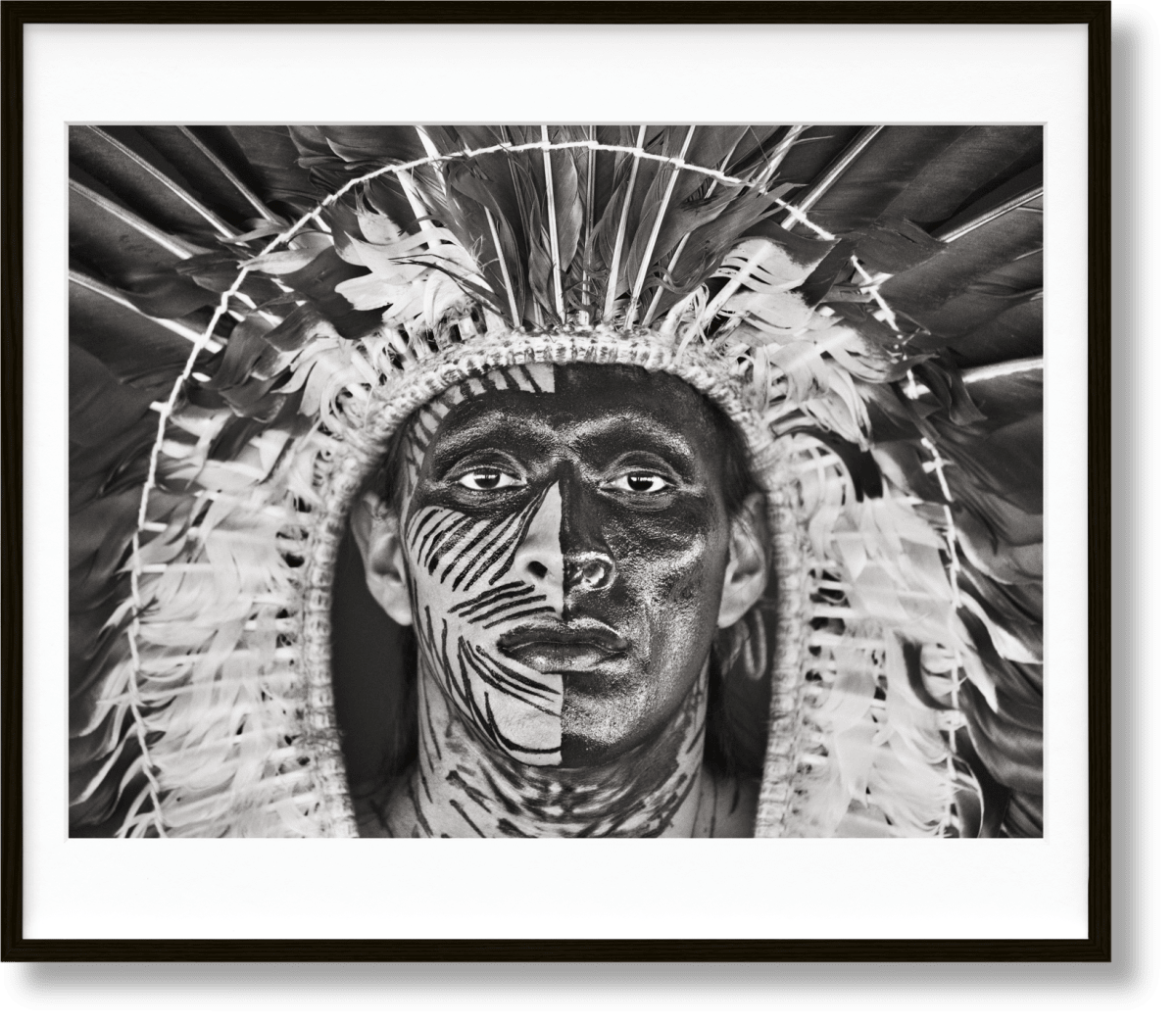Sebastião Salgado. Amazônia, Art Edition No. 1–100 ‘Adão Yawanawá in a headdress of eagle feathers’